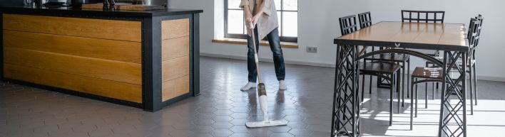 A Woman Mopping the Floor